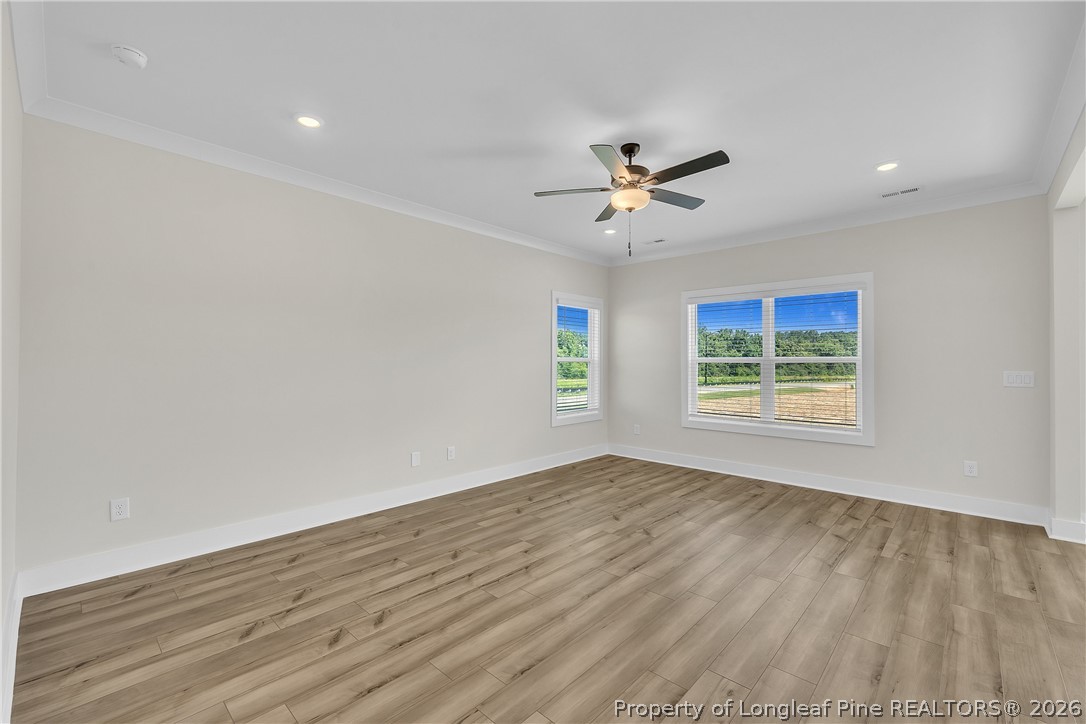 85 Camp Rock Road Lillington, NC 27546 - Photo 6 of 14 wooden floor in an empty room with a window
