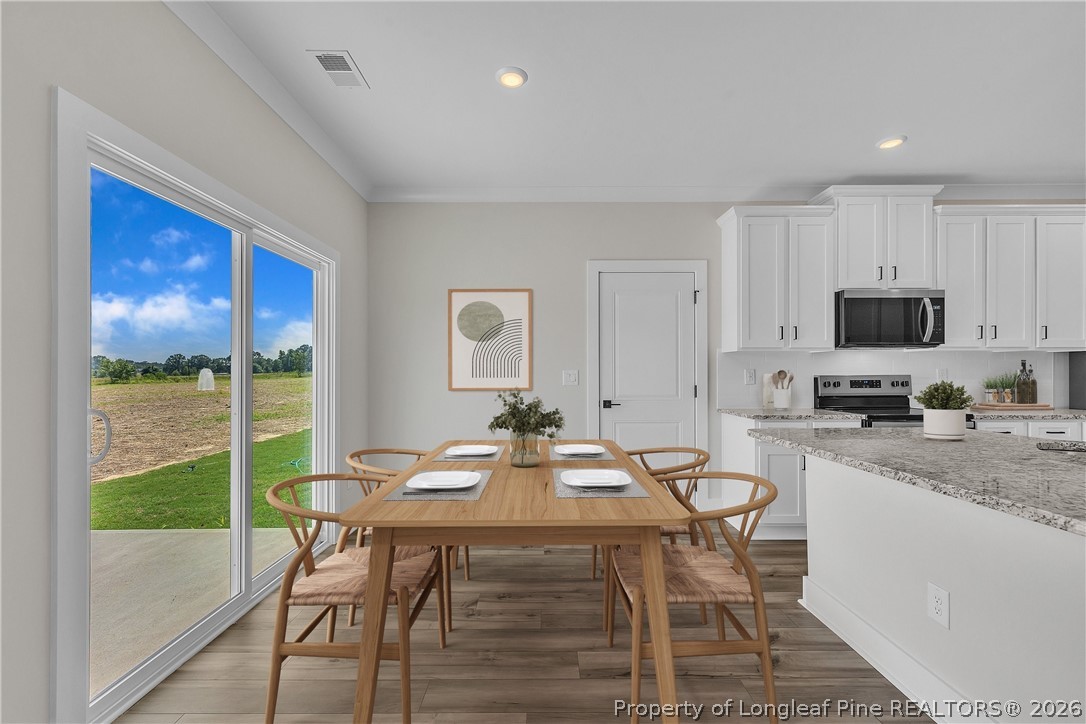 85 Camp Rock Road Lillington, NC 27546 - Photo 10 of 20 a view of a dining room with furniture window and outside view