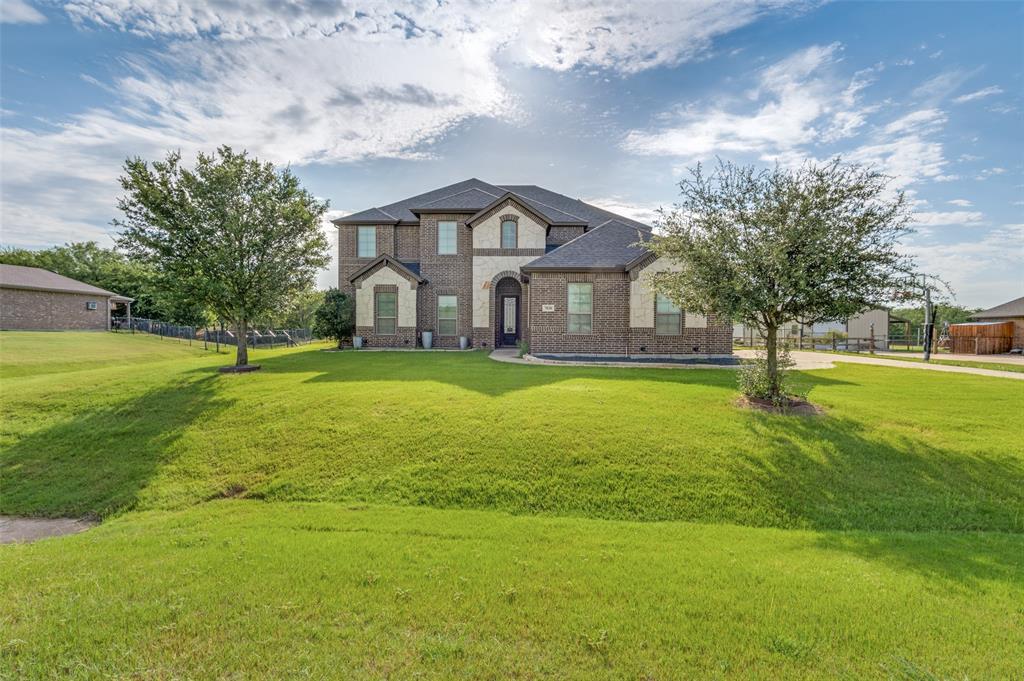 7830 Amanda Lane Midlothian, TX 76065 - Photo 1 of 1 a front view of a house with a yard and trees