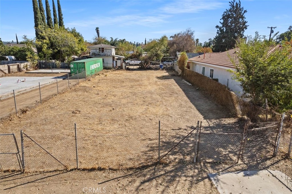 7538 Evans Street Riverside, CA 92504 - Photo 1 of 12 a view of a dry yard with wooden fence