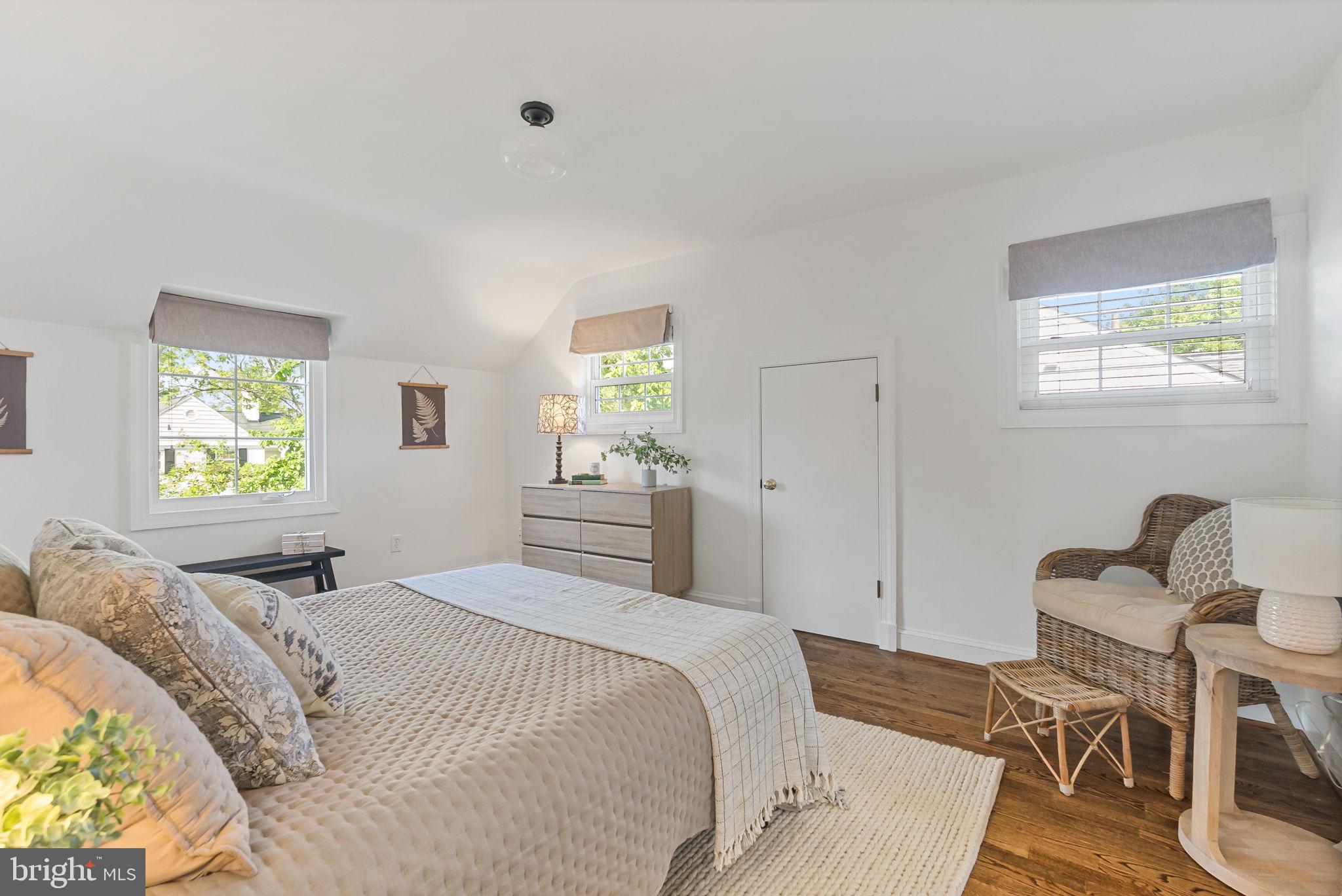 810 Grand View Drive Alexandria, VA 22305 - Photo 12 of 55 a bedroom with a bed and a table in it with window