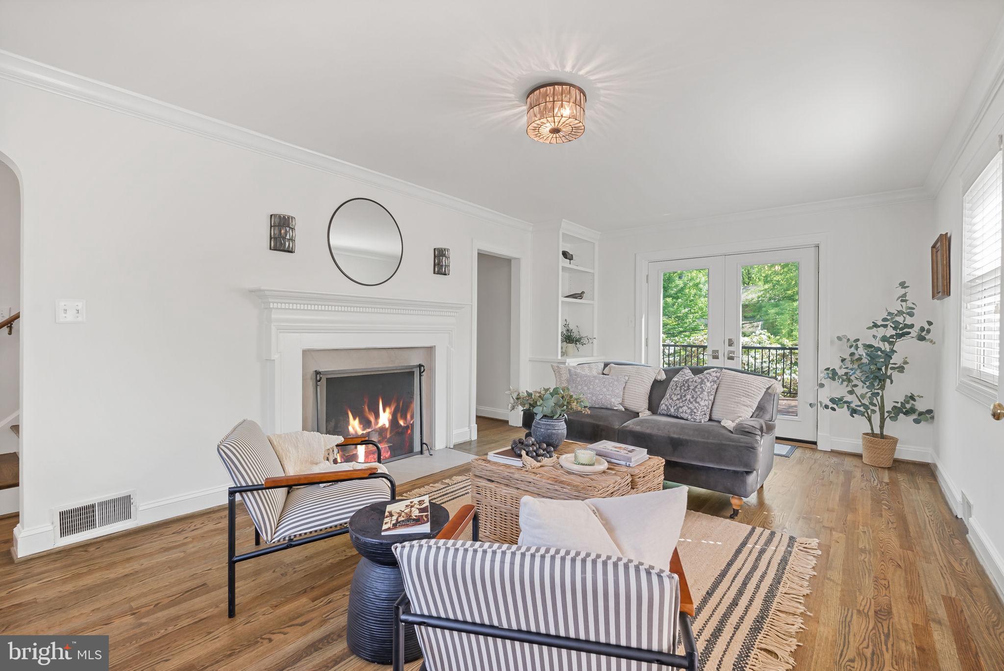 810 Grand View Drive Alexandria, VA 22305 - Photo 3 of 55 a living room with furniture and a fireplace