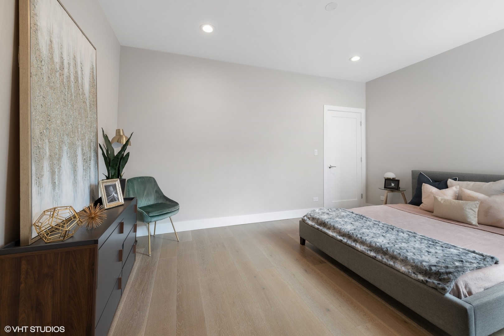 2342 West Adams Street, Unit 505 Chicago, IL 60612 - Photo 13 of 20 a bedroom with a bed and wooden floor