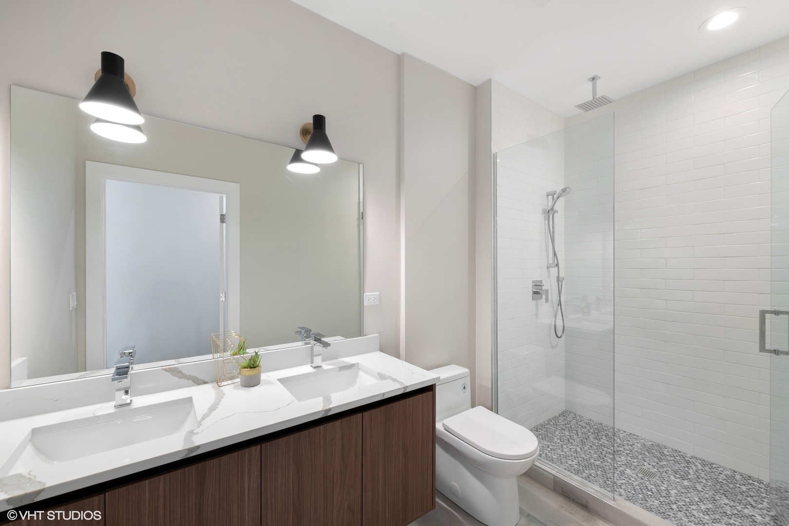 2342 West Adams Street, Unit 505 Chicago, IL 60612 - Photo 14 of 20 a bathroom with a sink toilet and a mirror