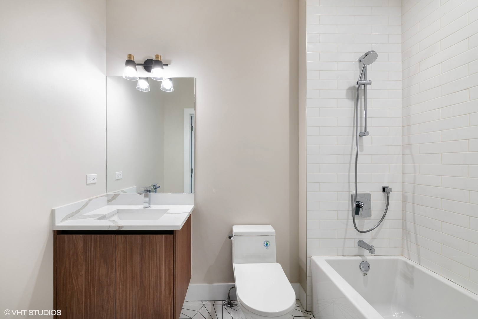 2342 West Adams Street, Unit 505 Chicago, IL 60612 - Photo 17 of 20 a bathroom with a sink a toilet and shower