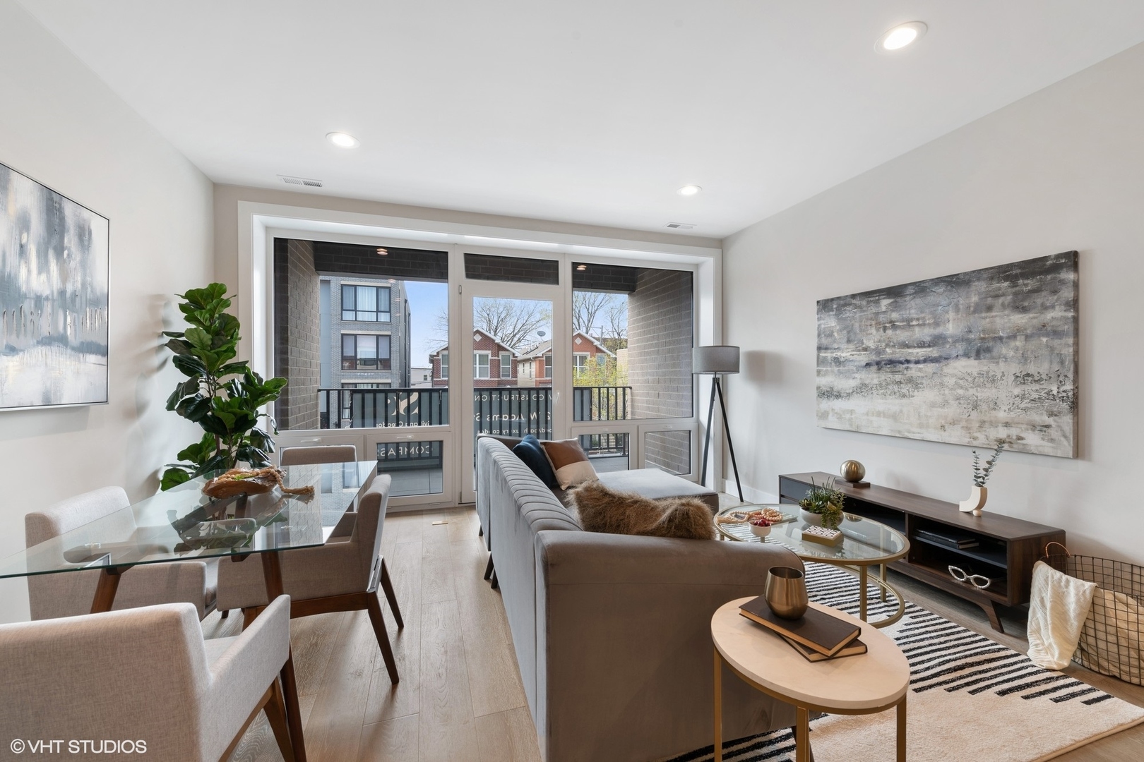 2342 West Adams Street, Unit 505 Chicago, IL 60612 - Photo 2 of 20 a living room with furniture and a potted plant