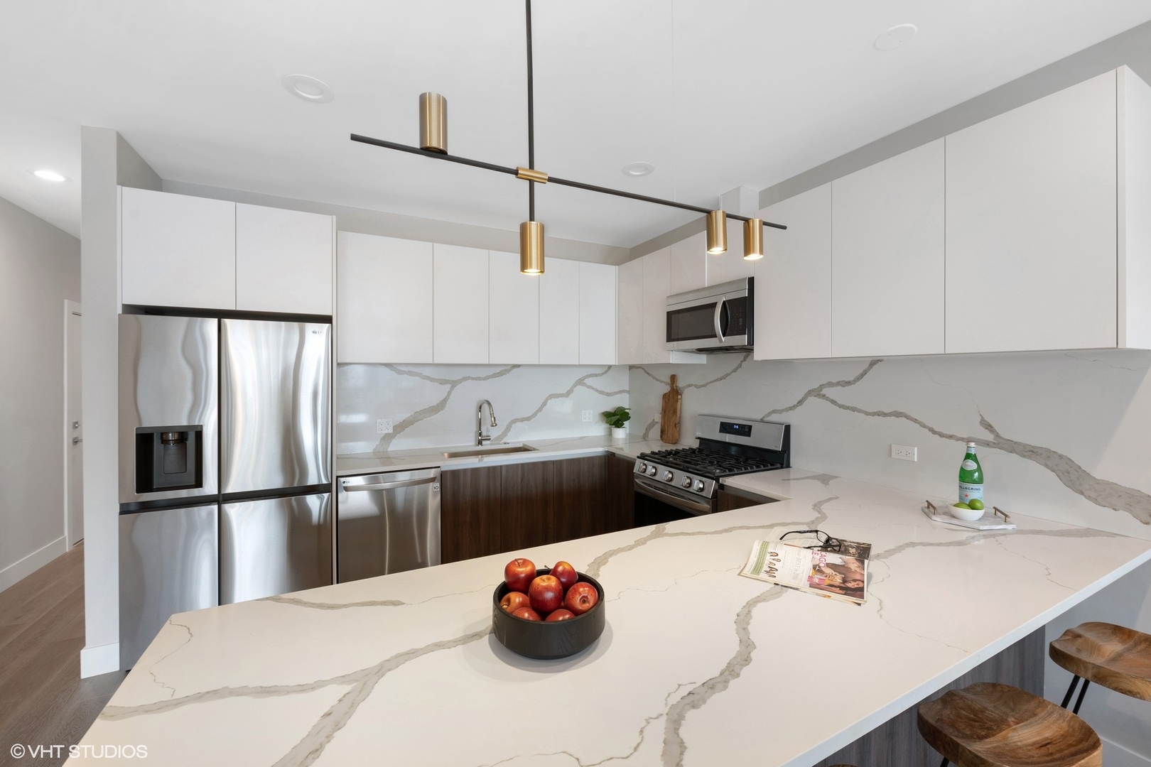 2342 West Adams Street, Unit 505 Chicago, IL 60612 - Photo 5 of 20 a kitchen with stainless steel appliances granite countertop a sink dishwasher stove top oven and refrigerator