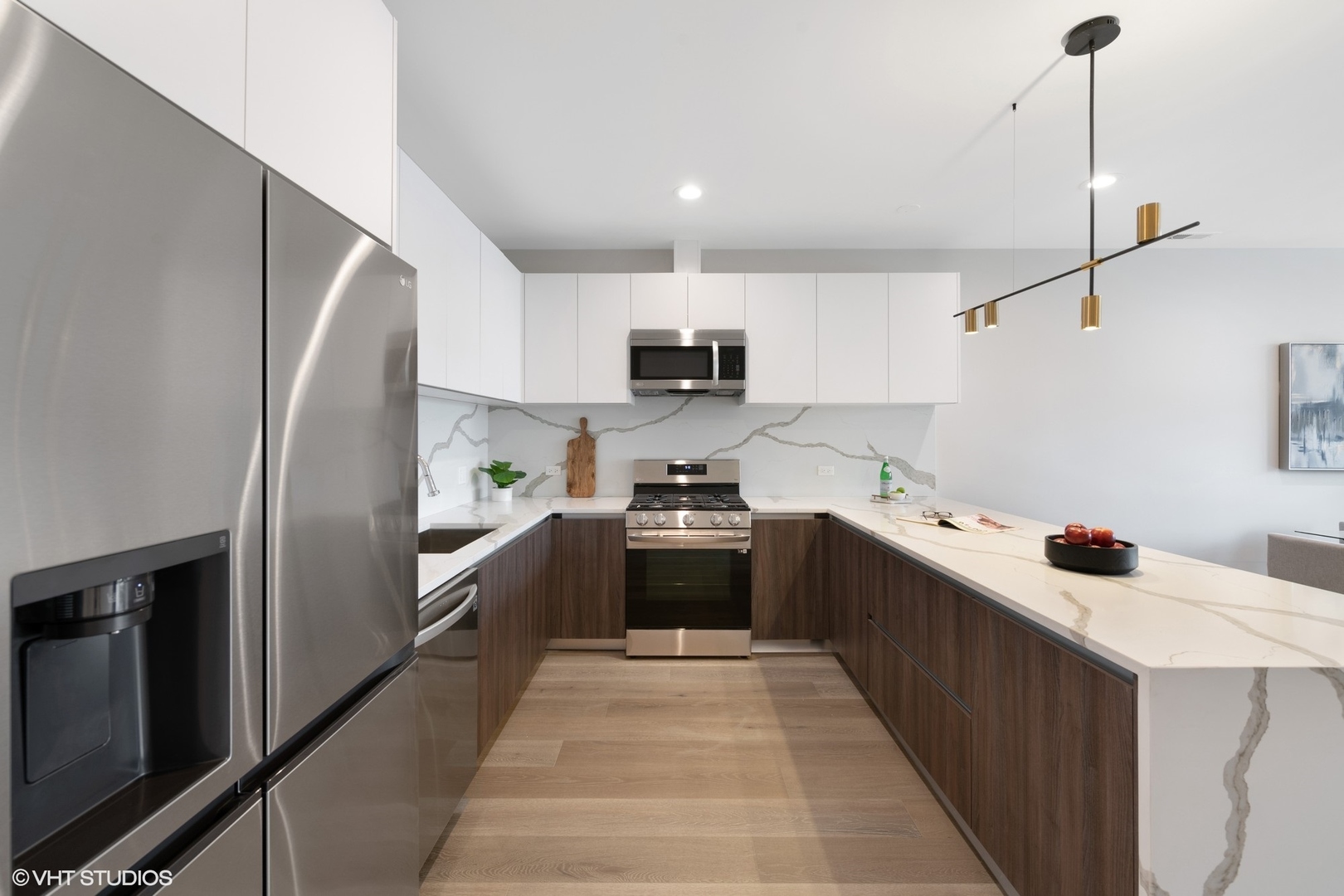 2342 West Adams Street, Unit 505 Chicago, IL 60612 - Photo 7 of 20 a kitchen with stainless steel appliances a refrigerator sink and stove