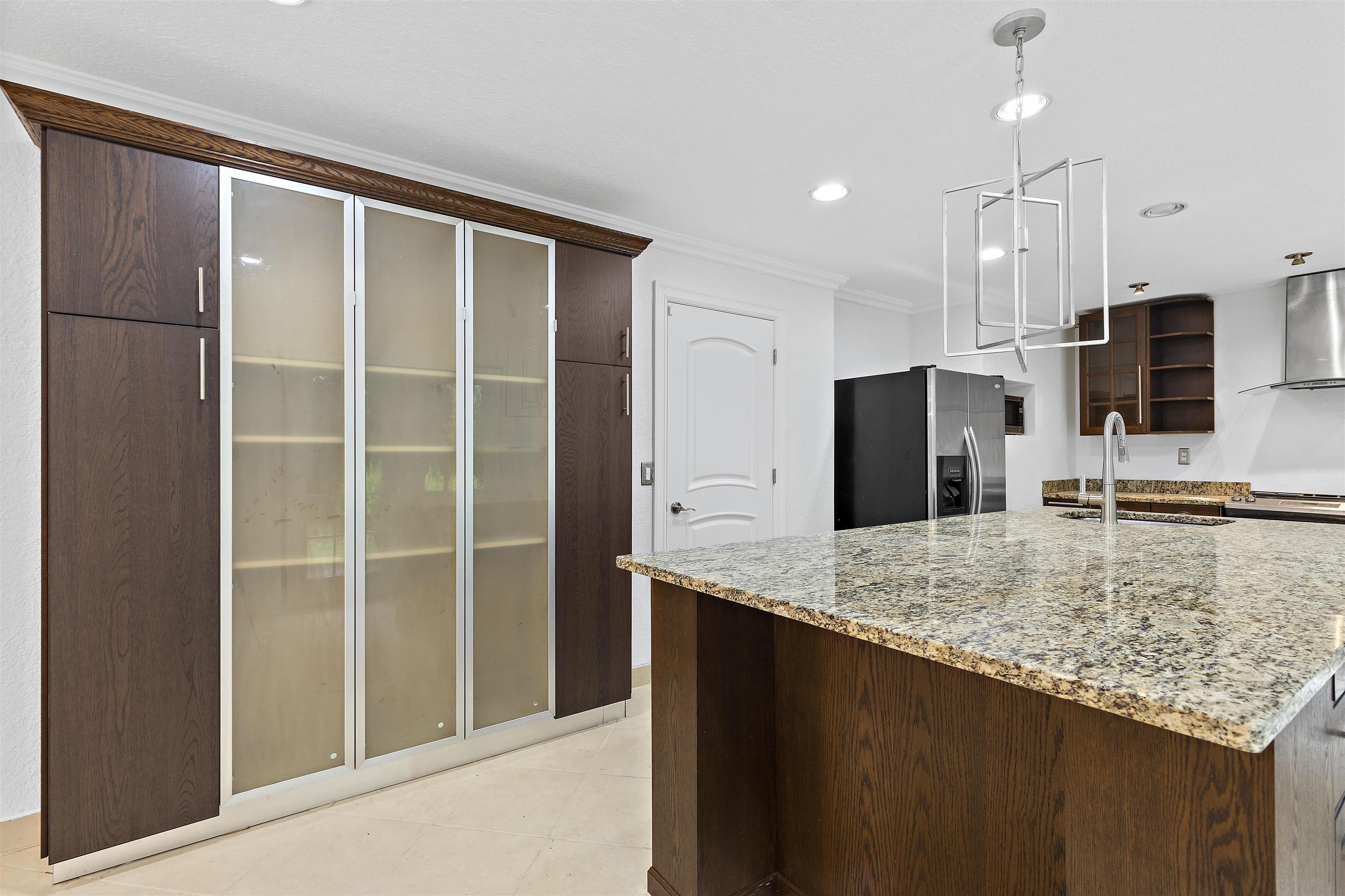 2906 Reid Farm Road Rockford, IL 61114 - Photo 11 of 18 a kitchen with kitchen island granite countertop a refrigerator and a sink