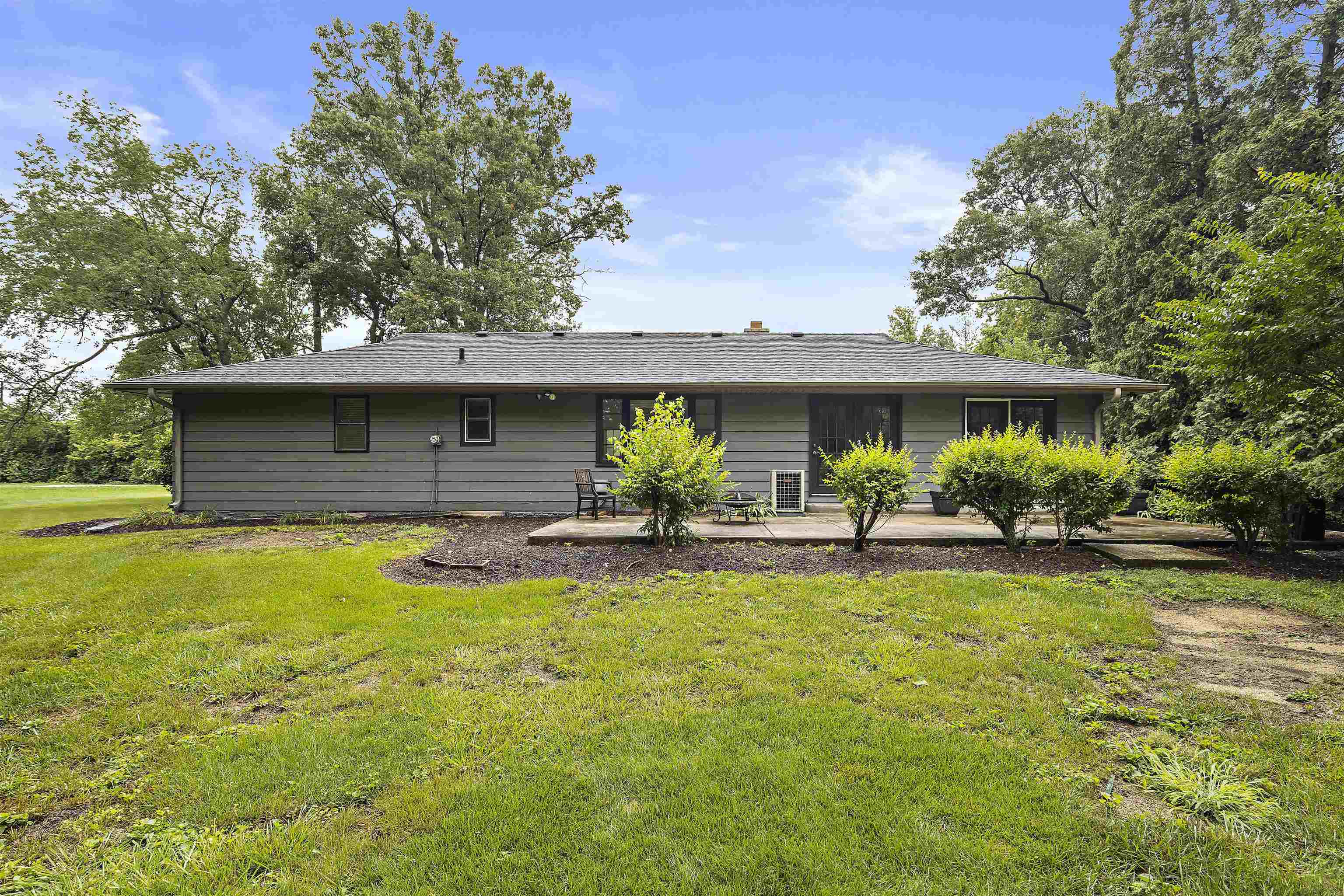 2906 Reid Farm Road Rockford, IL 61114 - Photo 15 of 18 a view of a house with pool and a yard