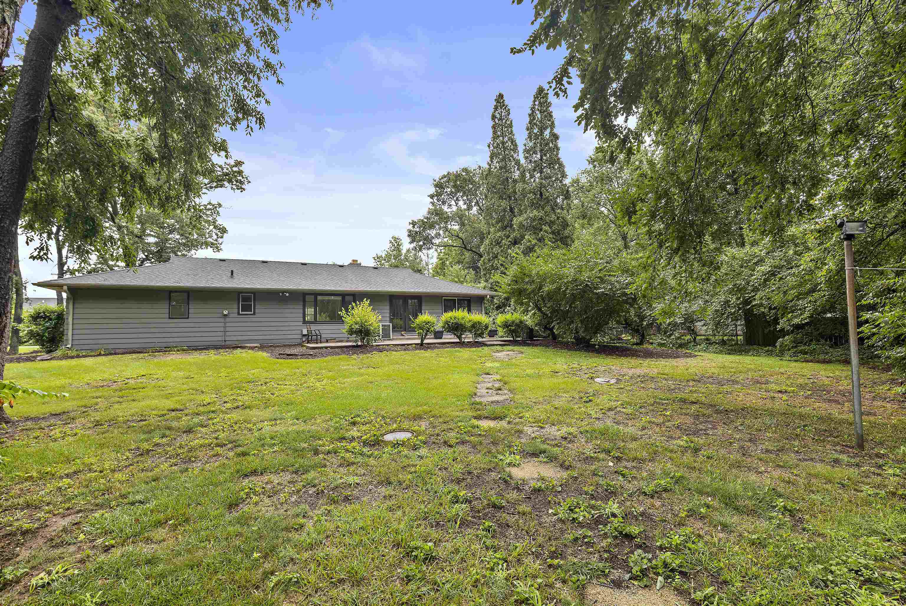 2906 Reid Farm Road Rockford, IL 61114 - Photo 16 of 18 a view of a house with a yard