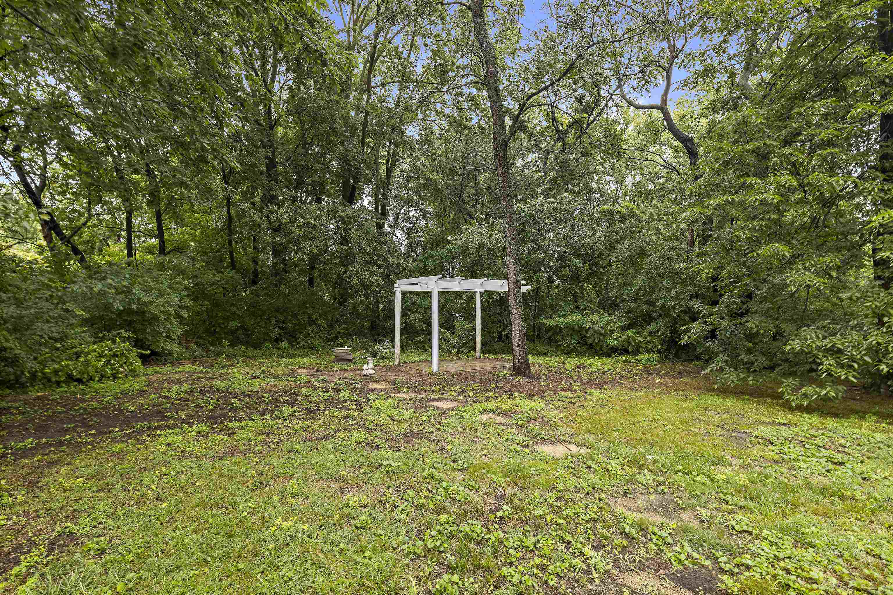 2906 Reid Farm Road Rockford, IL 61114 - Photo 18 of 18 a view of a big yard with trees