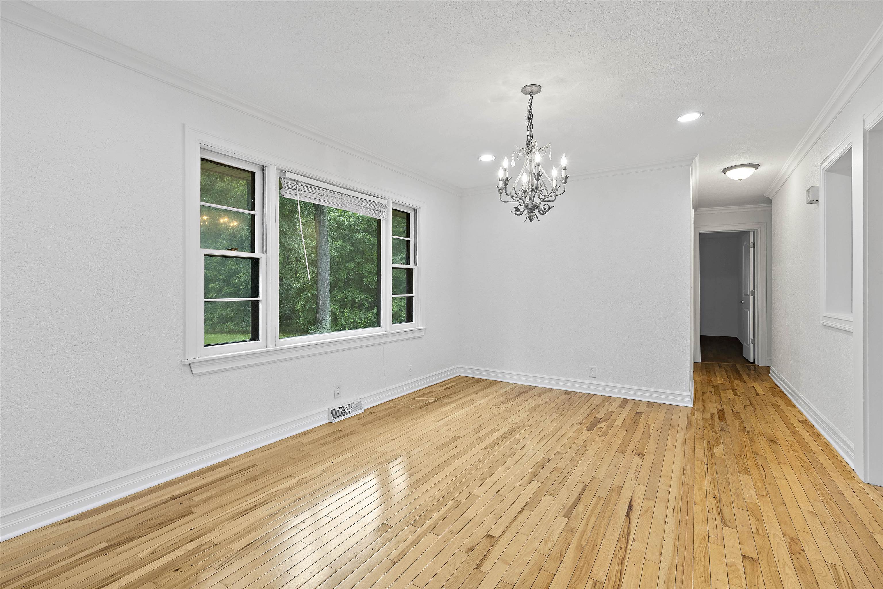 2906 Reid Farm Road Rockford, IL 61114 - Photo 5 of 18 a view of empty room with wooden floor and fan