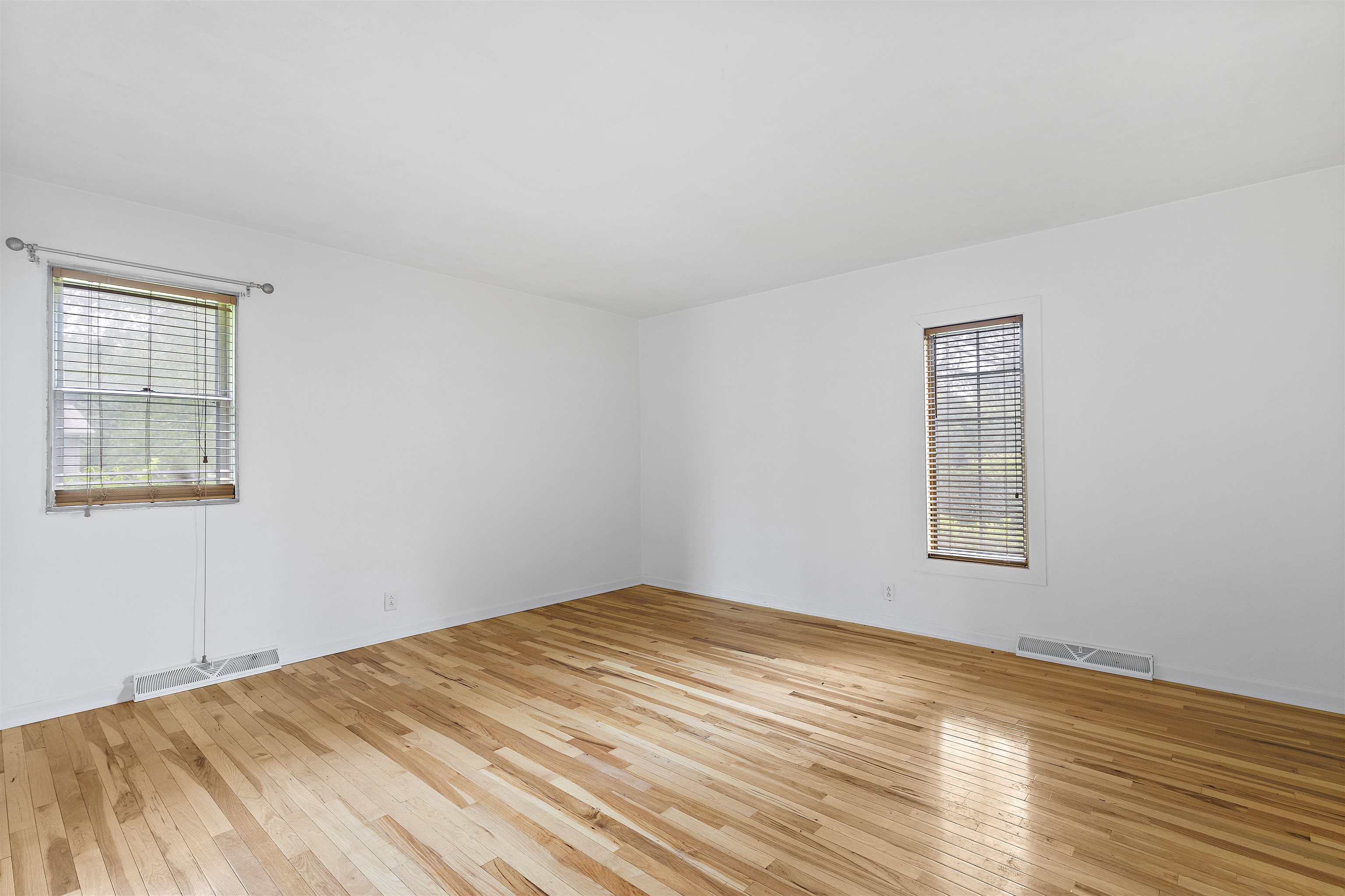 2906 Reid Farm Road Rockford, IL 61114 - Photo 6 of 18 a view of empty room with wooden floor and fan