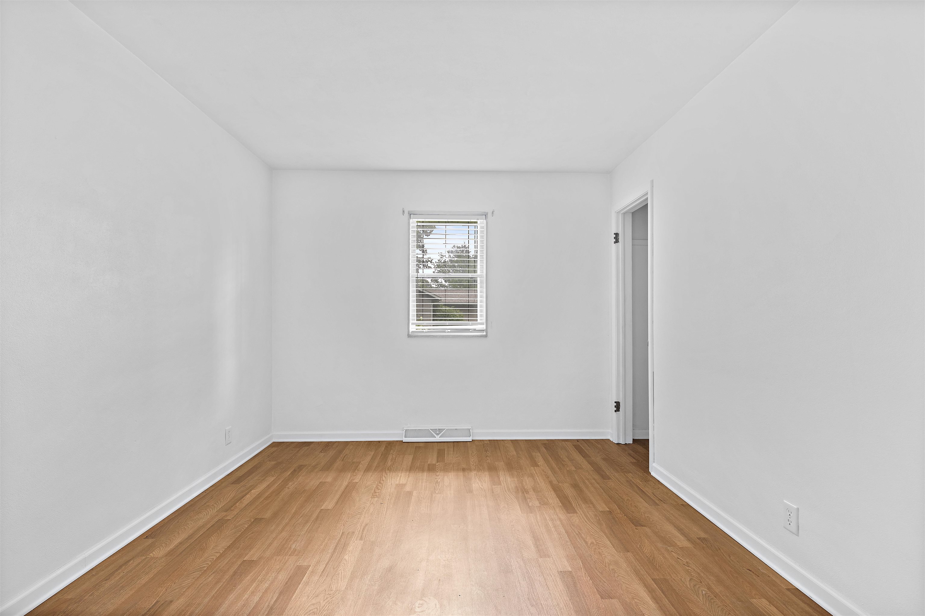 2906 Reid Farm Road Rockford, IL 61114 - Photo 7 of 18 an empty room with wooden floor and windows