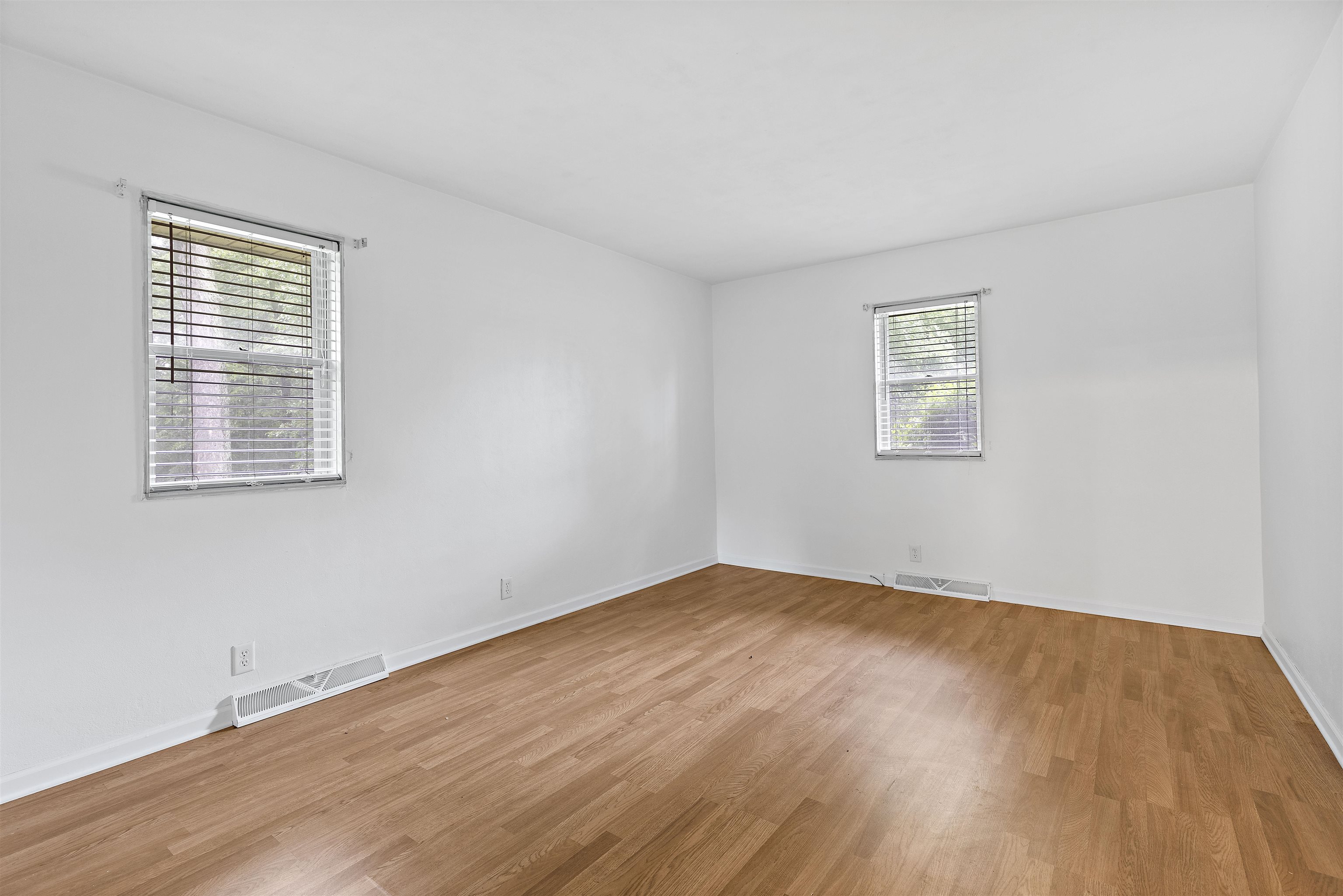 2906 Reid Farm Road Rockford, IL 61114 - Photo 8 of 18 a view of an empty room with wooden floor and a window