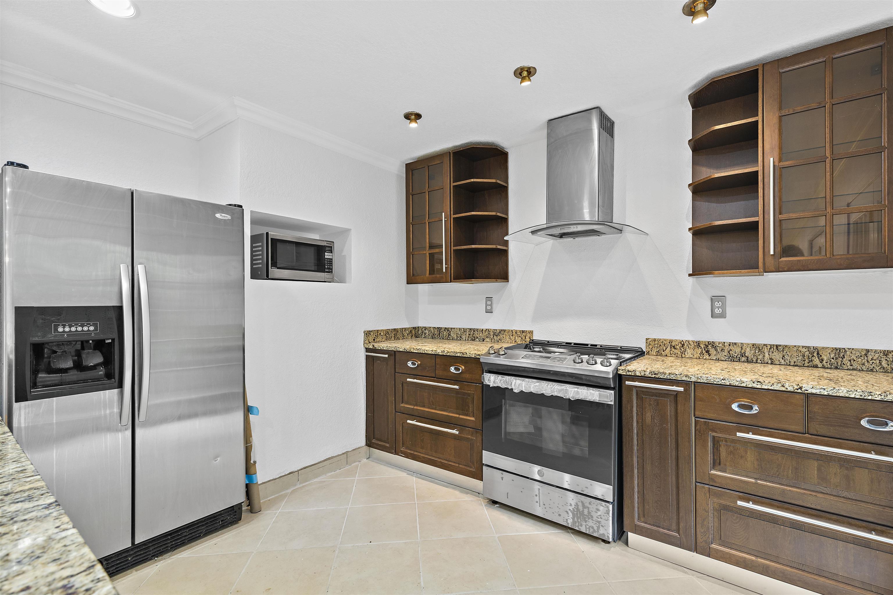2906 Reid Farm Road Rockford, IL 61114 - Photo 9 of 18 a kitchen with stainless steel appliances granite countertop a stove and a refrigerator