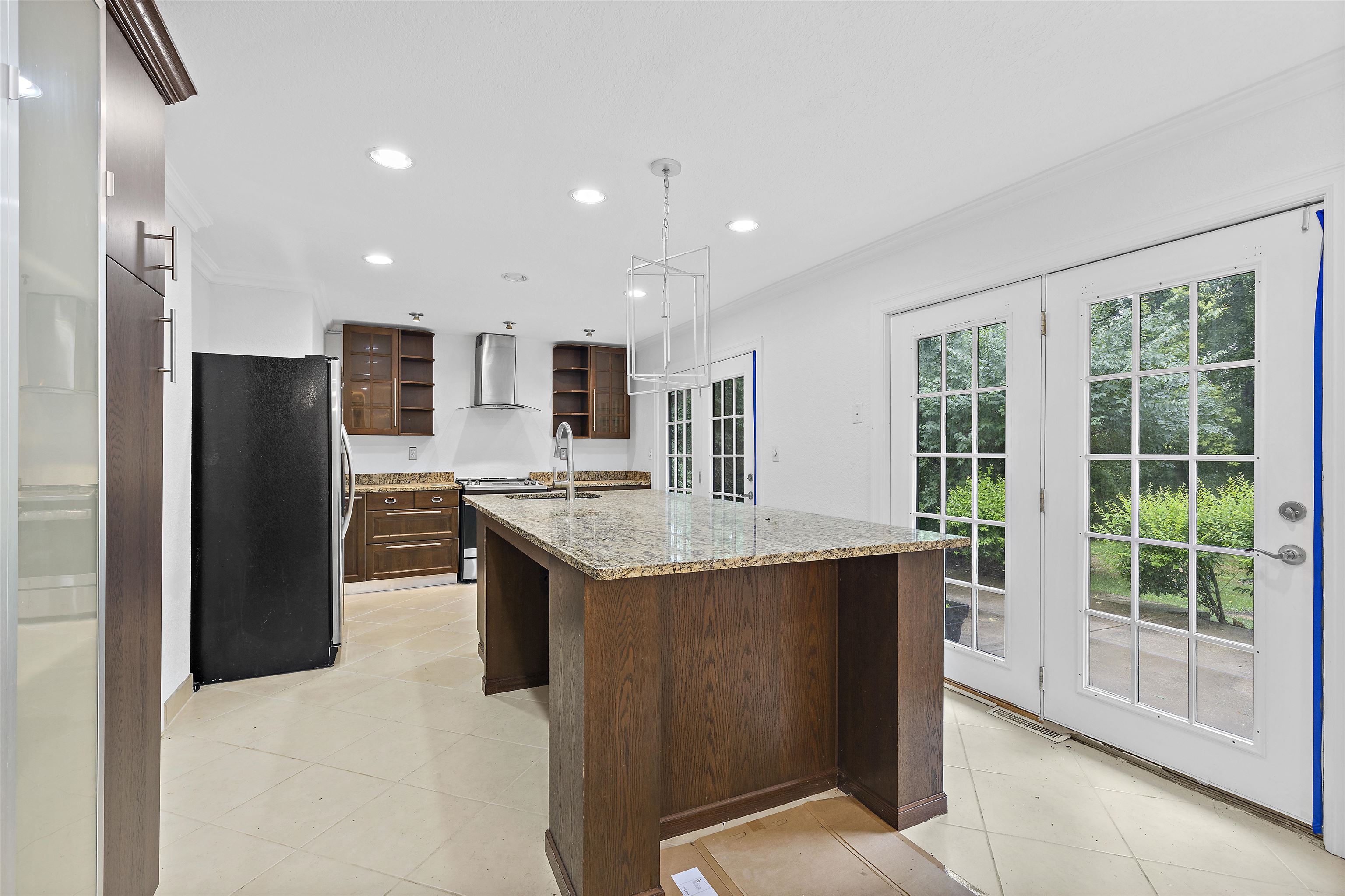 2906 Reid Farm Road Rockford, IL 61114 - Photo 10 of 18 a kitchen with stainless steel appliances kitchen island granite countertop a refrigerator and a sink