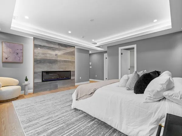a bedroom with a bed and a fireplace