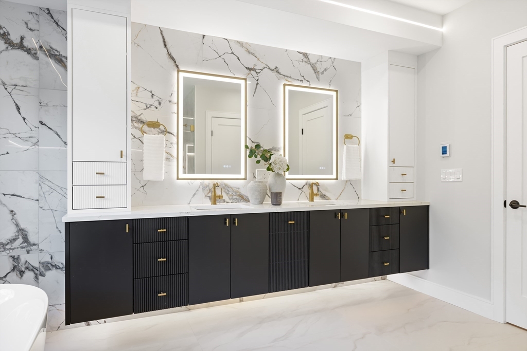 27 High Street, Unit 27 Newton, MA 02461 - Photo 20 of 39 a bathroom with a double vanity sink and mirror