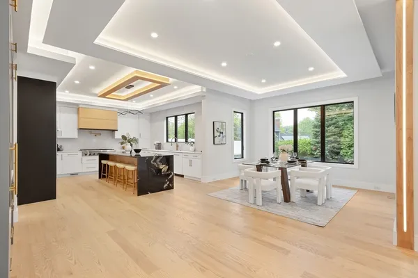 a living room with furniture and large windows