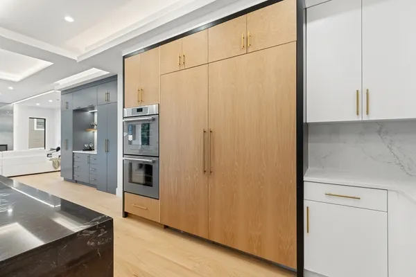 a view of a kitchen with a refrigerator