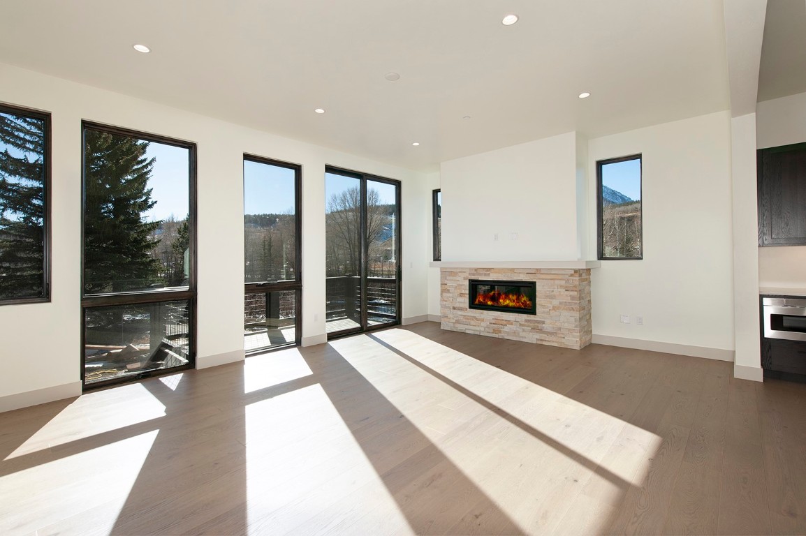 36 Geneva Drive, Unit H2 Silverthorne, CO 80498 - Photo 2 of 9 a spacious bedroom with a large bed and a large window