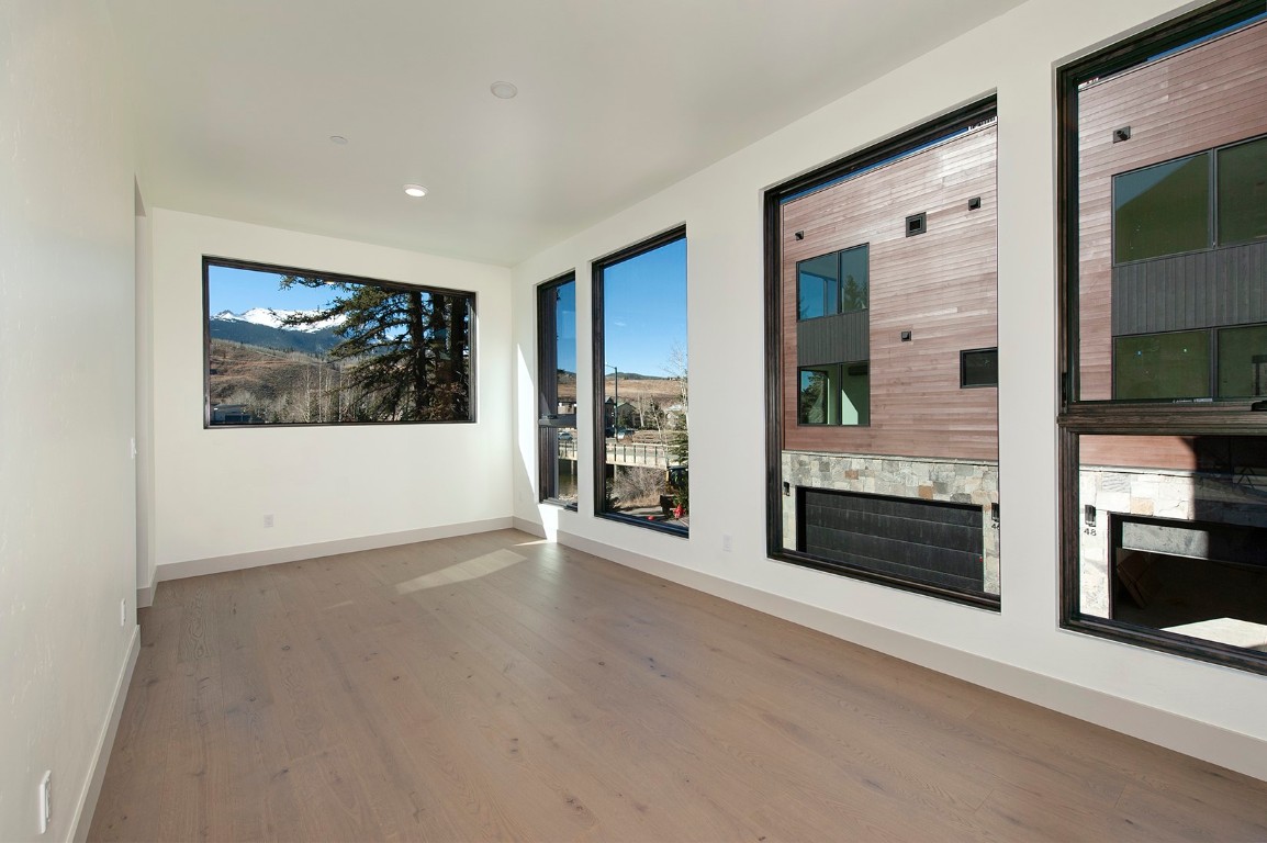 36 Geneva Drive, Unit H2 Silverthorne, CO 80498 - Photo 4 of 9 a view of a living room with window and fireplace