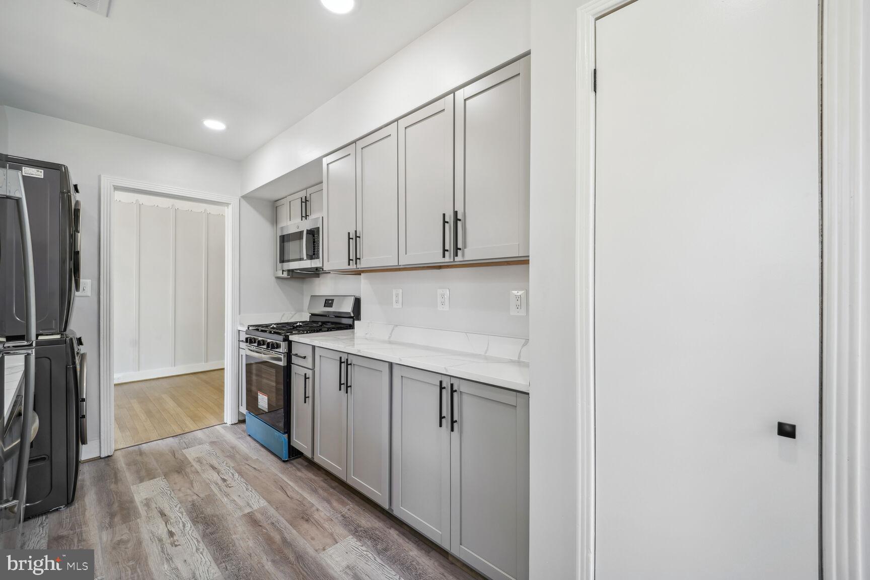 9900 Colesville Road Silver Spring, MD 20901 - Photo 13 of 23 Kitchen with New Cabinets, New Quartz Counter Tops