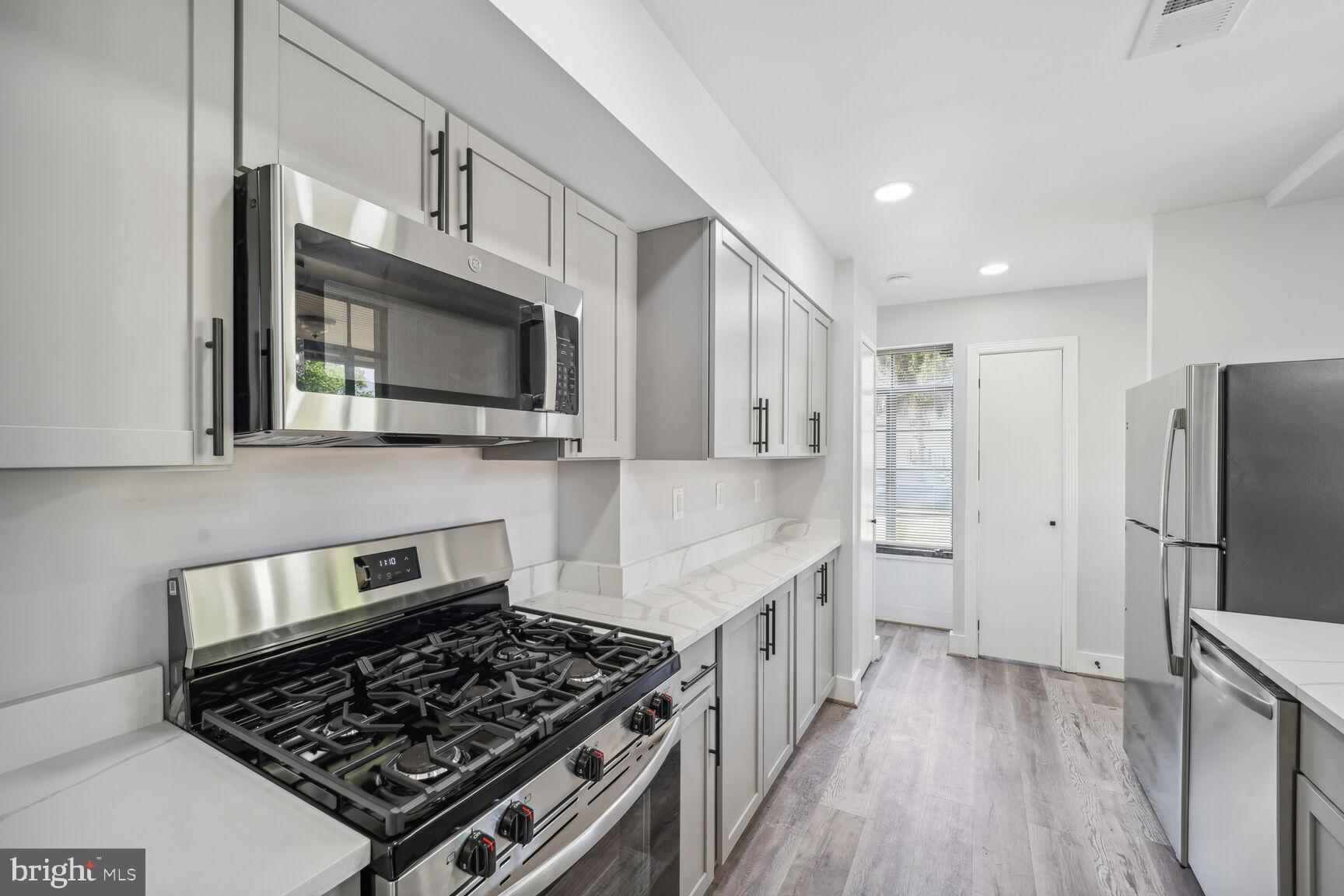 9900 Colesville Road Silver Spring, MD 20901 - Photo 4 of 23 Kitchen with New Stainless Steel Appliances