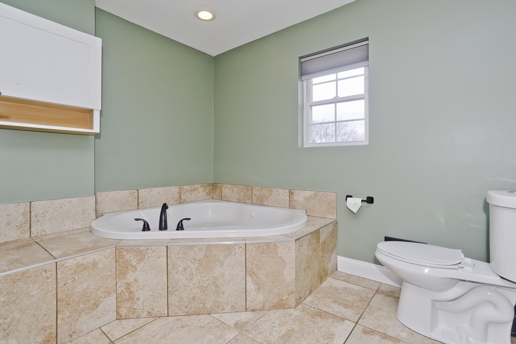 48 Mountain Avenue West Springfield, MA 01089 - Photo 28 of 39 a spacious bathroom with a bathtub and toilet