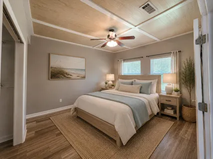 a bedroom with bed and a chandelier