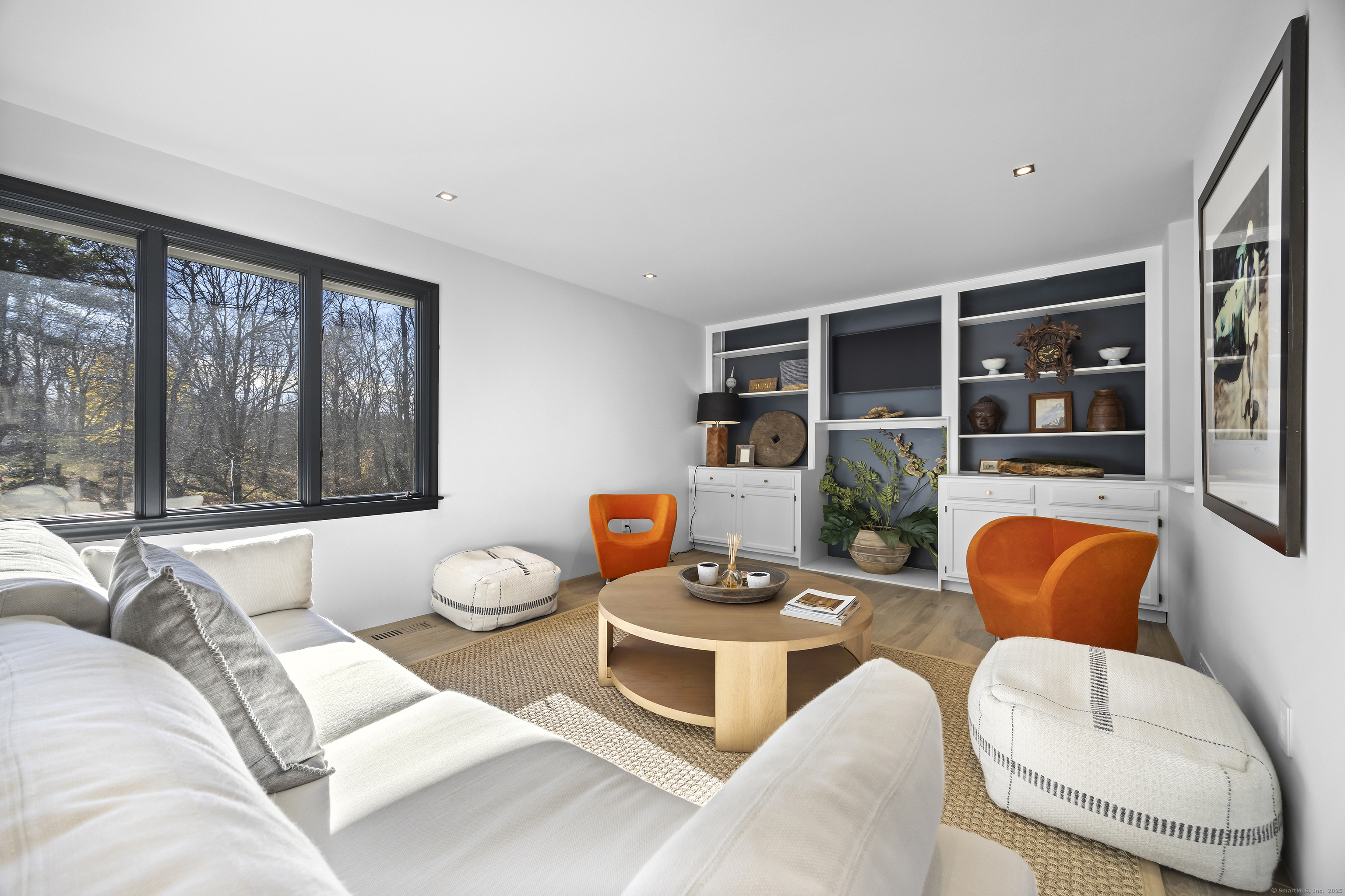 1001 Hulls Farm Road Fairfield, CT 06890 - Photo 12 of 40 a living room with furniture and a large window