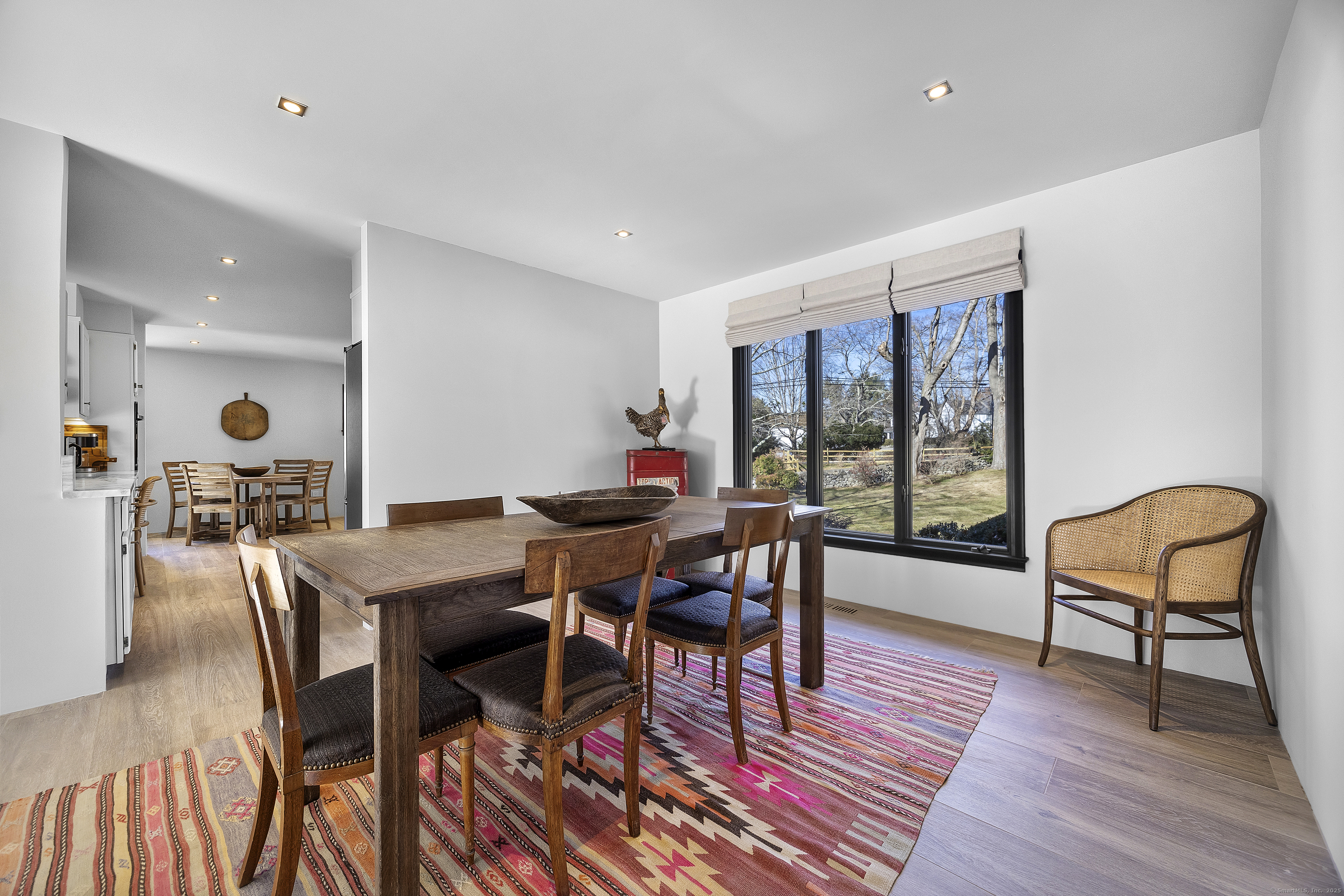 1001 Hulls Farm Road Fairfield, CT 06890 - Photo 13 of 40 a dining room with furniture and wooden floor