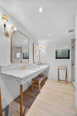 a room with a table chairs and wooden floor