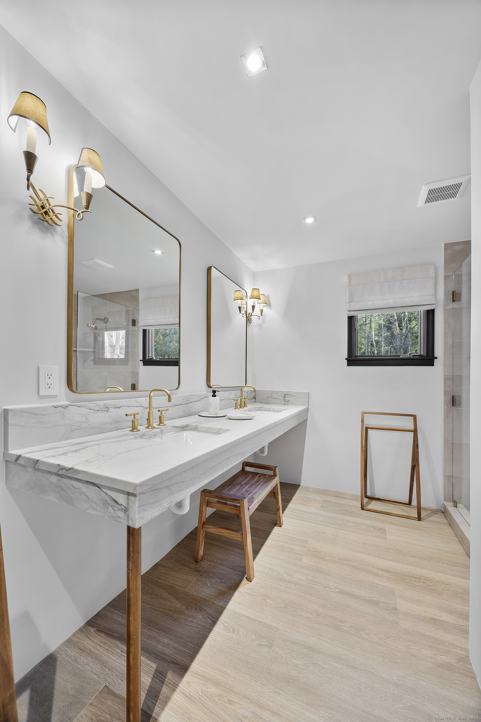 1001 Hulls Farm Road Fairfield, CT 06890 - Photo 22 of 40 a room with a table chairs and wooden floor