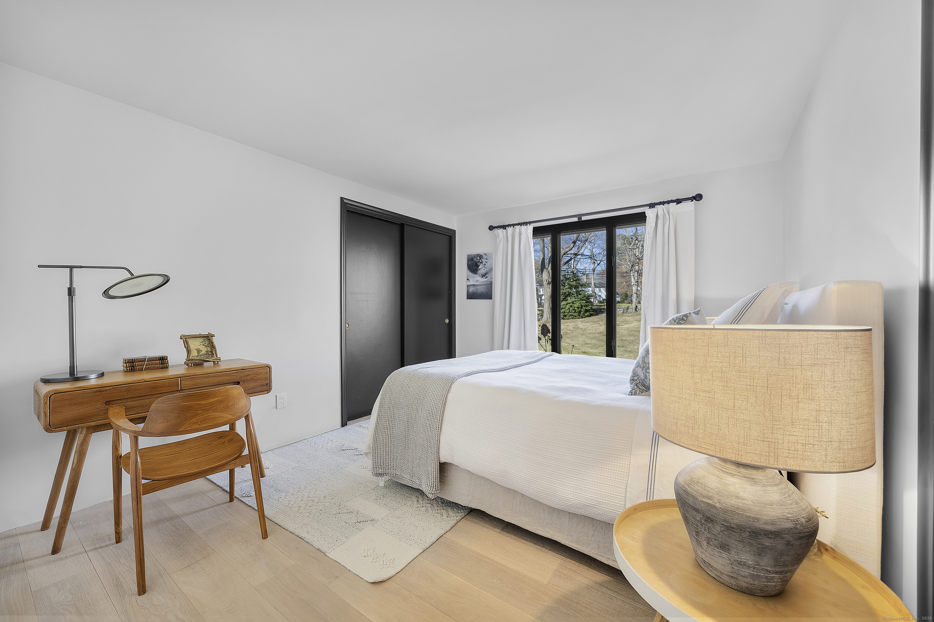 1001 Hulls Farm Road Fairfield, CT 06890 - Photo 25 of 40 a bedroom with a bed and a window