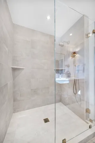 a bathroom with a bathtub and shower