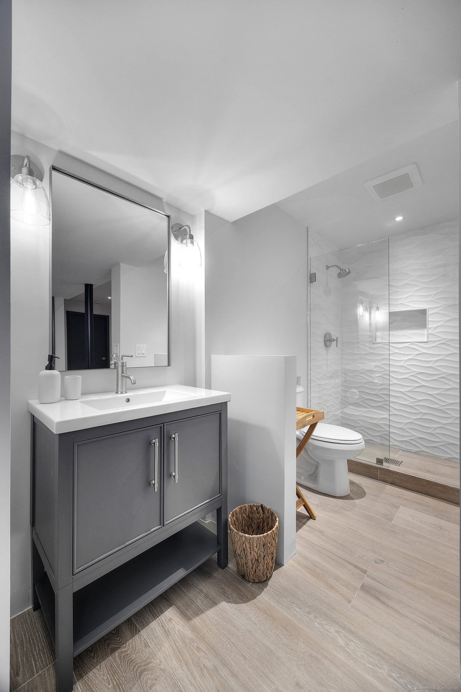 1001 Hulls Farm Road Fairfield, CT 06890 - Photo 32 of 40 a bathroom with a sink and a mirror