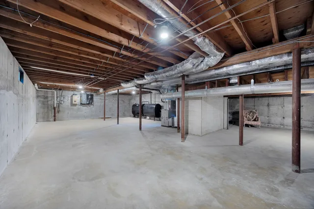 a view of empty room with wooden ceiling