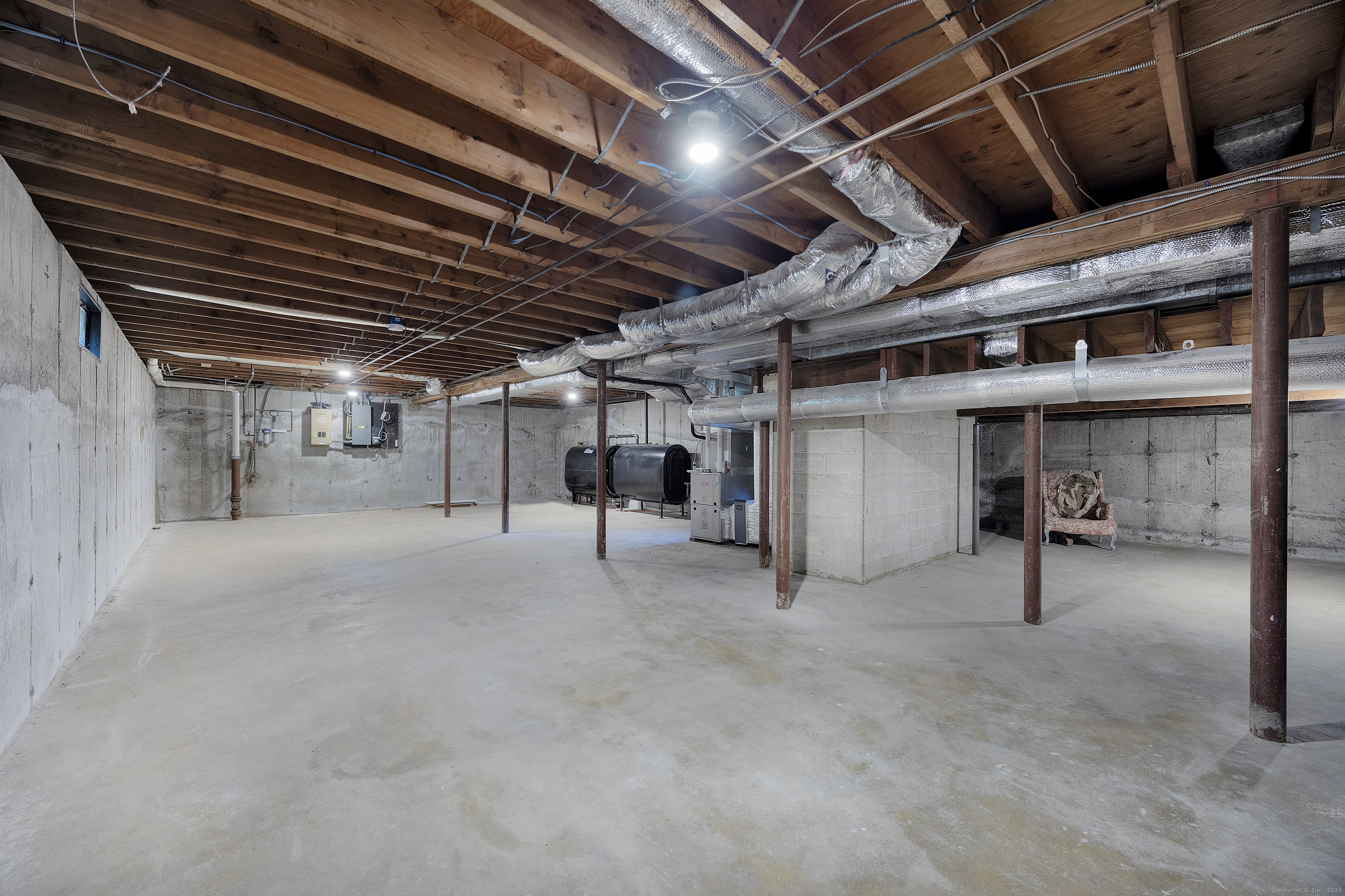1001 Hulls Farm Road Fairfield, CT 06890 - Photo 34 of 40 a view of empty room with wooden ceiling