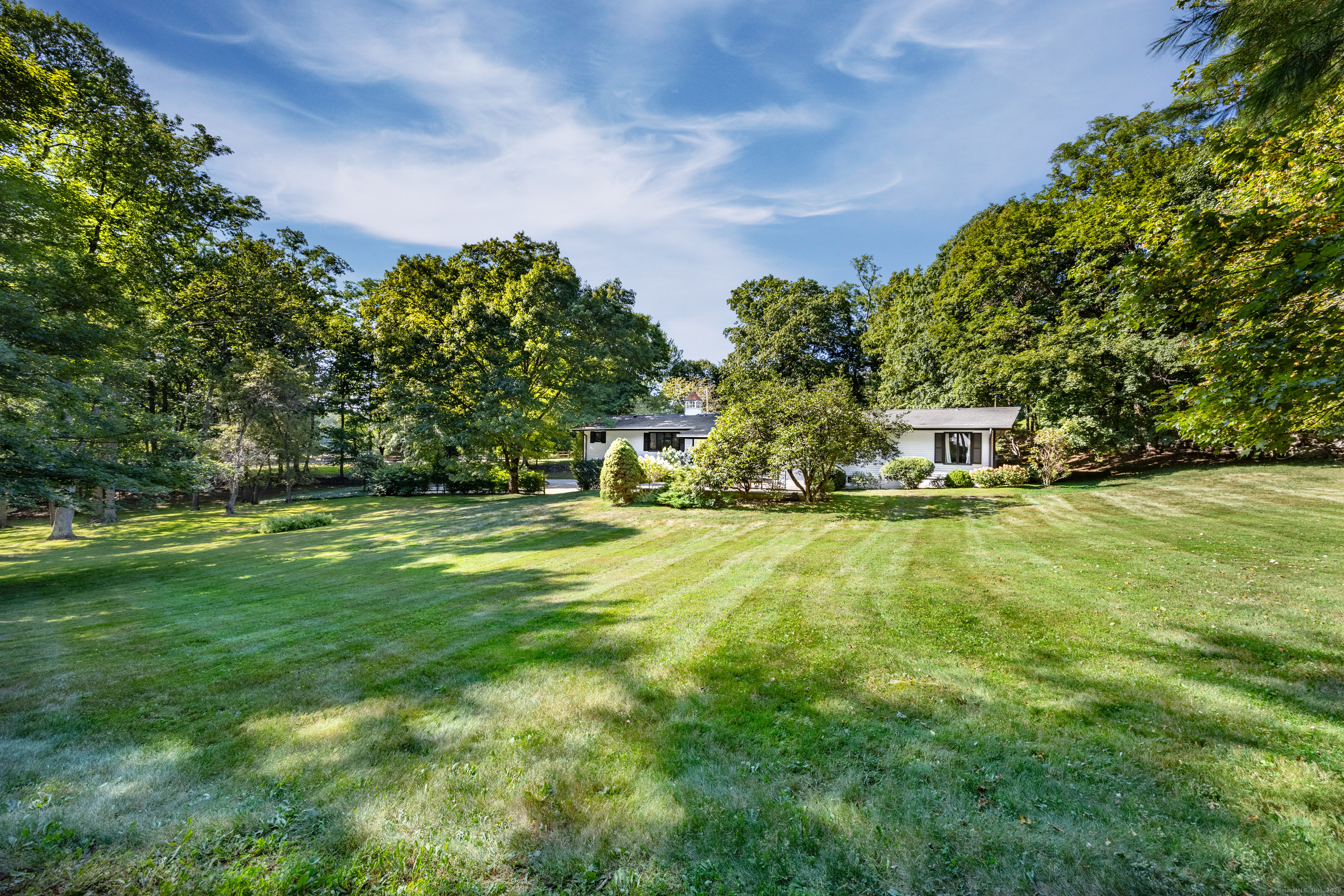 1001 Hulls Farm Road Fairfield, CT 06890 - Photo 38 of 40 a view of yard with swimming pool and trees