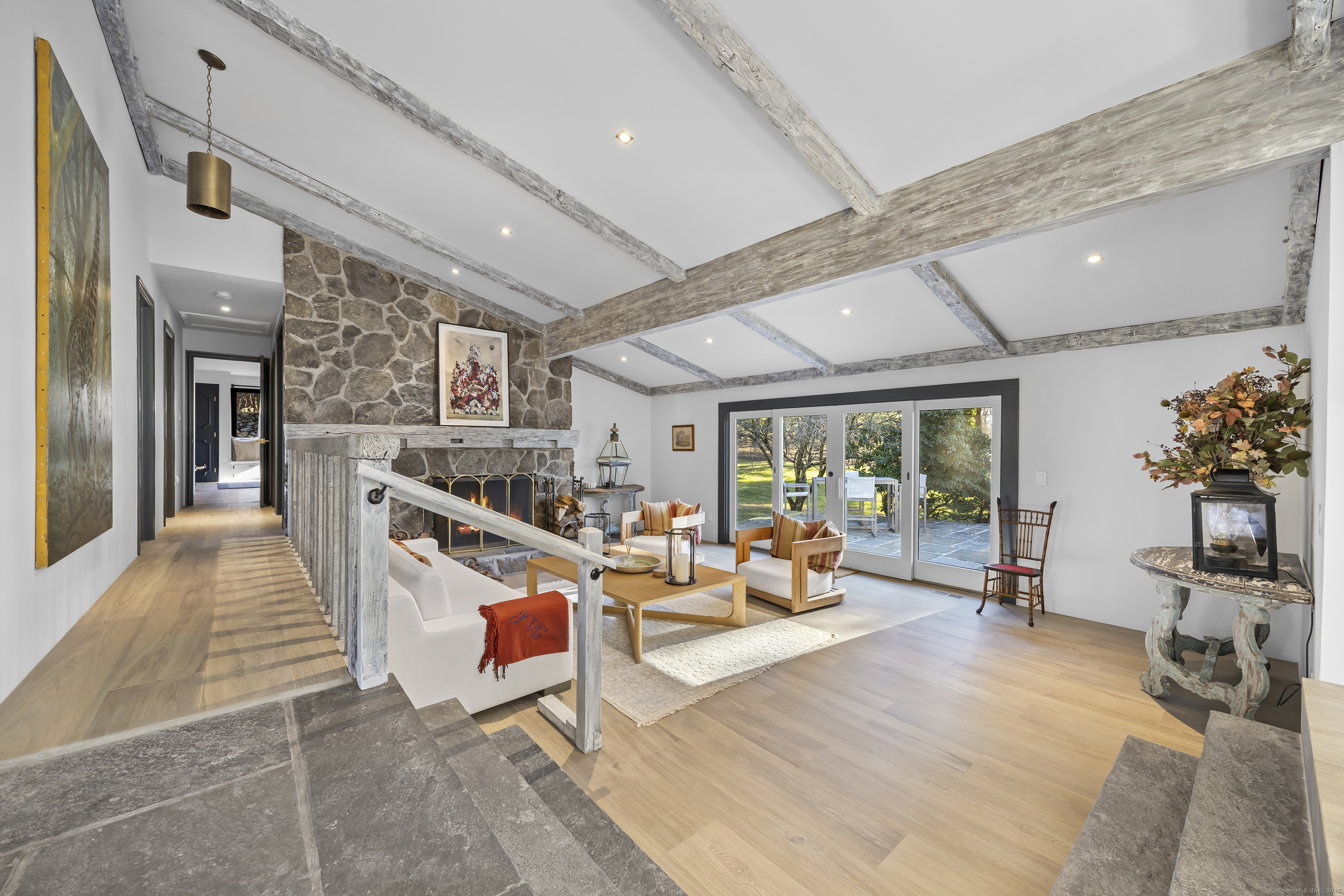 1001 Hulls Farm Road Fairfield, CT 06890 - Photo 5 of 40 a living room with furniture kitchen view and large windows