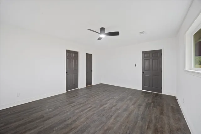 a bathroom with a toilet a sink and a mirror