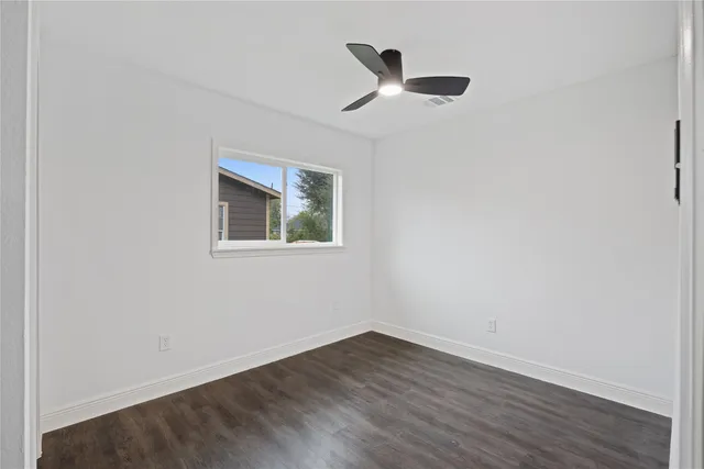 a view of an house with backyard space and garden