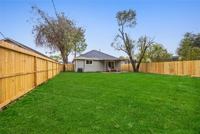 a view of a house with a back yard