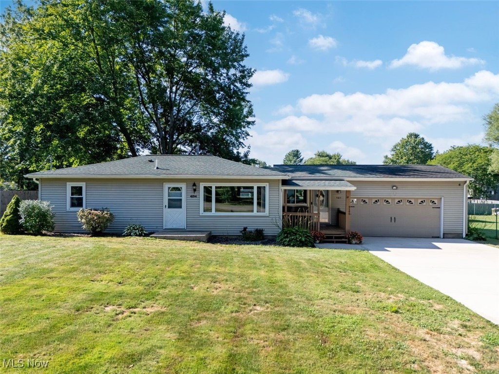 4184 Johnson Road Barberton, OH 44203 - Photo 1 of 25 Ranch-style house featuring concrete driveway and a garage