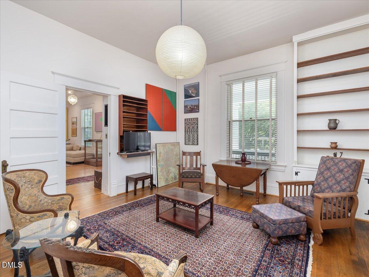 215 Hillcrest Road Raleigh, NC 27605 - Photo 23 of 97 a living room with furniture and a large window
