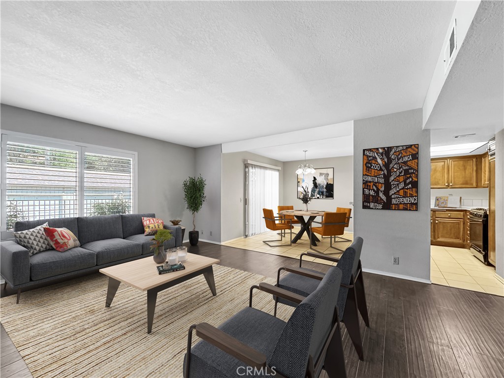 600 Central Avenue, Unit 323 Riverside, CA 92507 - Photo 6 of 25 a living room with furniture and wooden floor