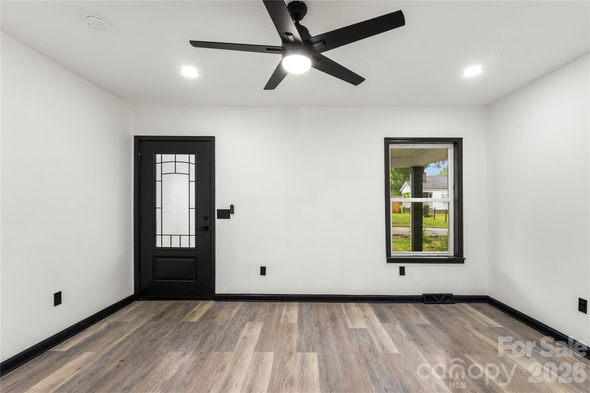 110 Courtland Street Chester, SC 29706 - Photo 3 of 22 an empty room with closet and windows